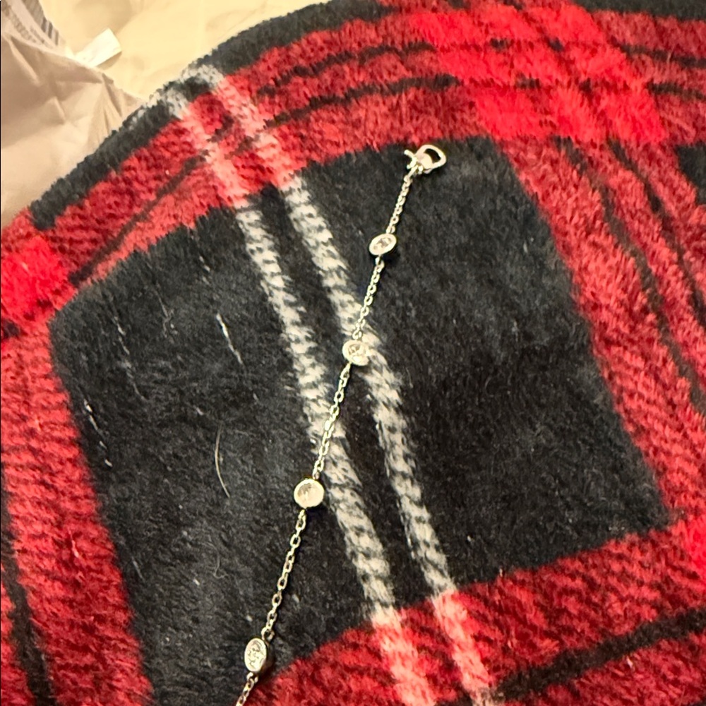 Silver Chain Bracelet with Red and Black Plaid Background